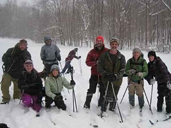 Wilderness Voyageurs staff and friends posing for a group shot during a Saturday afternoon ski.