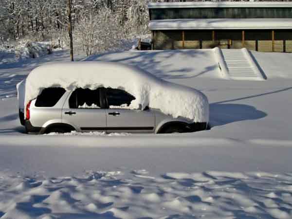 Kasia's car buried in the snow in front of the Wilderness Voyageurs bath house!