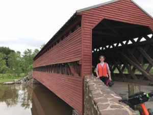 Guest in front of Sachs Covered Bridge