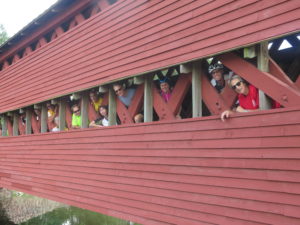 Guests peeking out of Sachs Covered Bridge