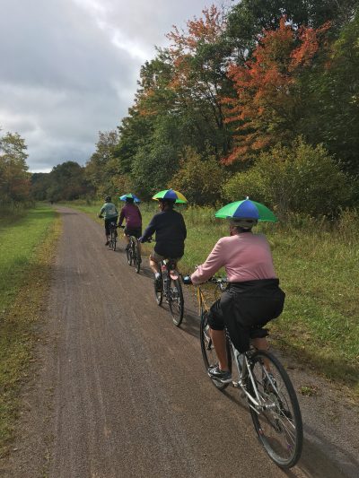 Cyclists riding along the great allegheny passage on a wilderness voyageurs bike tour