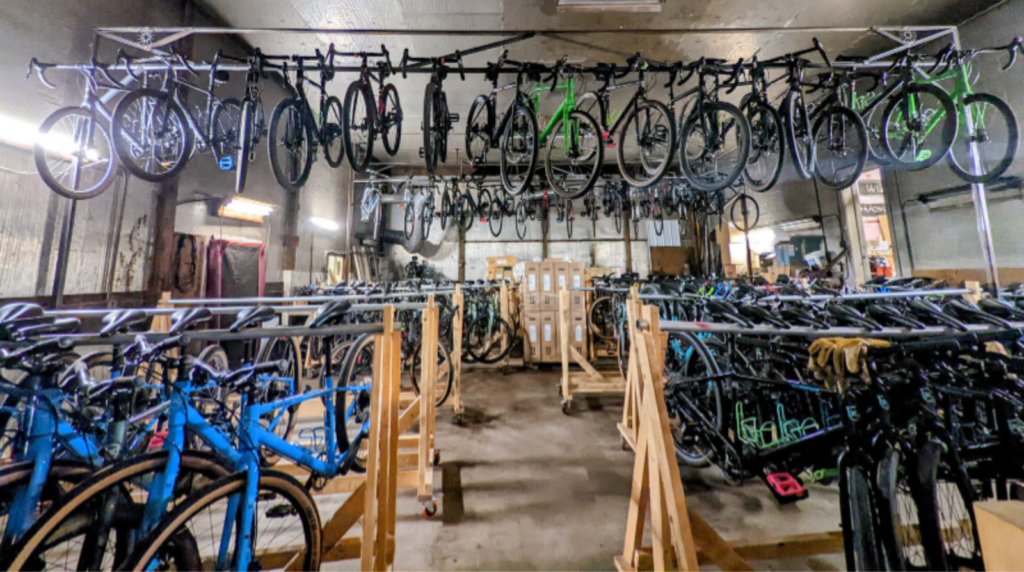 bikes hung up on racks in our warehouse for our 2024 bike sale