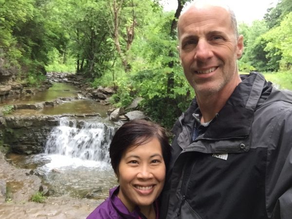 Biking Couple enjoying waterfall on Kentucky Bike and Bourbon tour with Wilderness Voyageurs