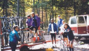 People unload bikes from a trailer during an early Wilderness Voyageurs bike tour