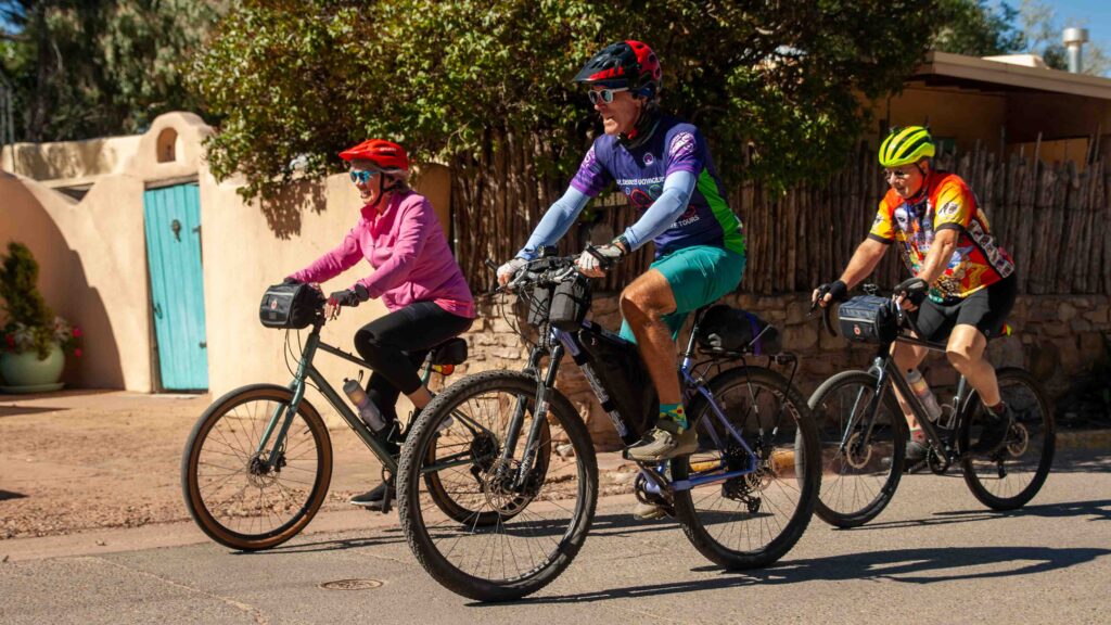 Cyclists riding up Canyon Road in Santa Fe, New Mexico.